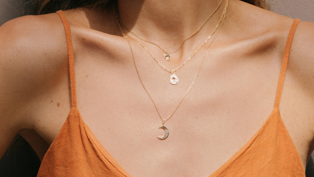 Woman wearing boho gold necklaces