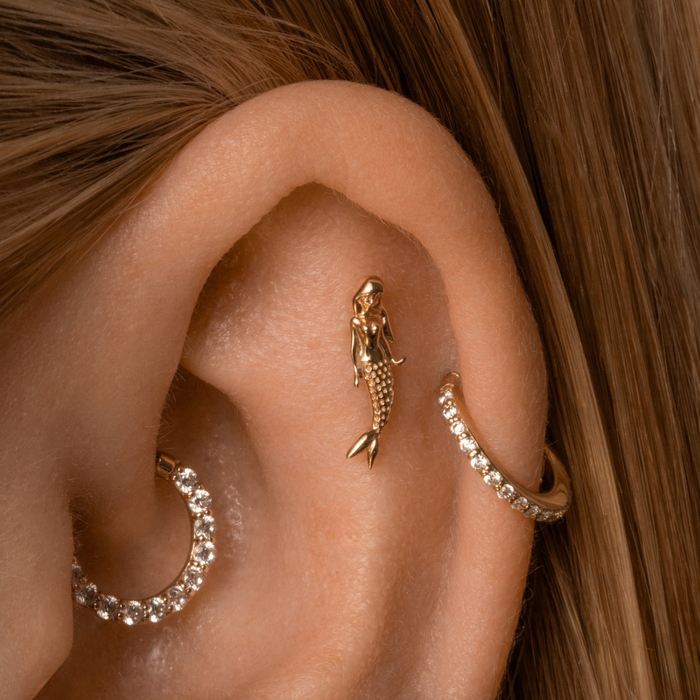 Laura Bond Jewellery 14k solid yellow gold mermaid flat back labret stud earring 8mm (left) Cartilage Studs